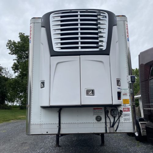 Trailer with big air conditioning unit on roof.